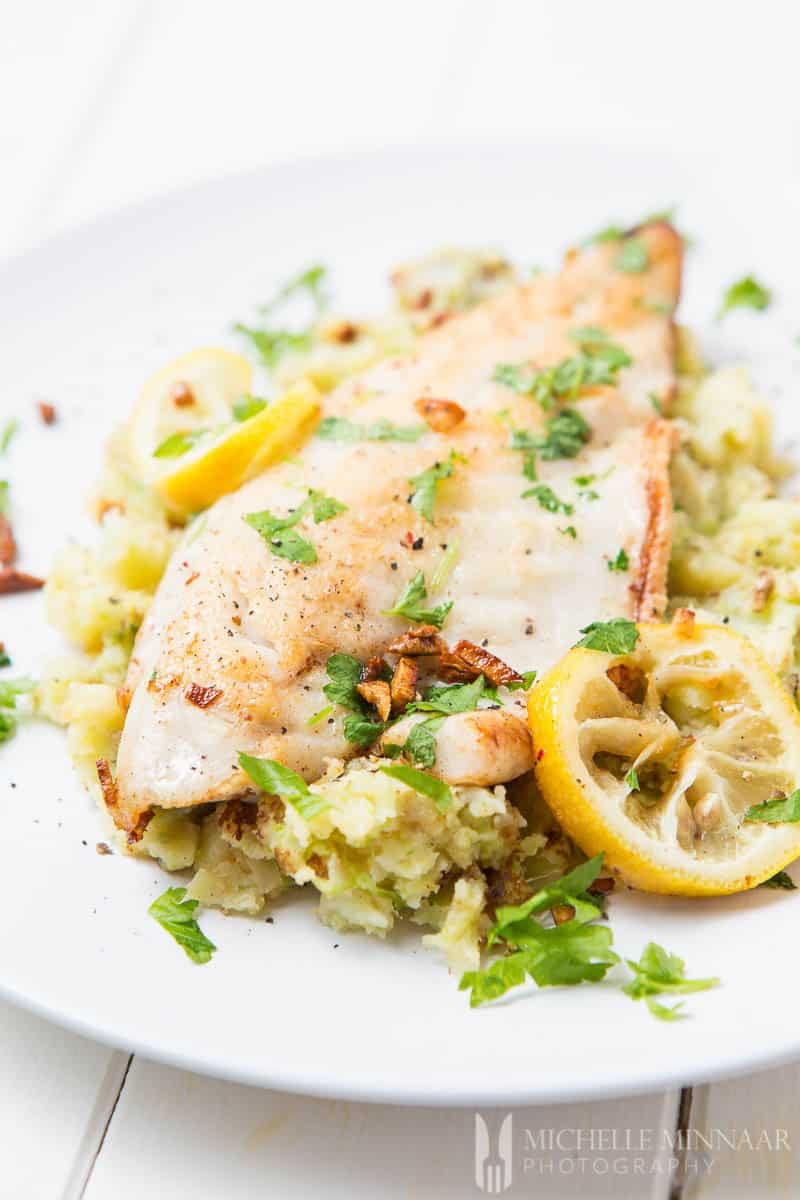 Pan Fried Seabass With Garlic Lemon Butter Sauce And Spring Vegetables