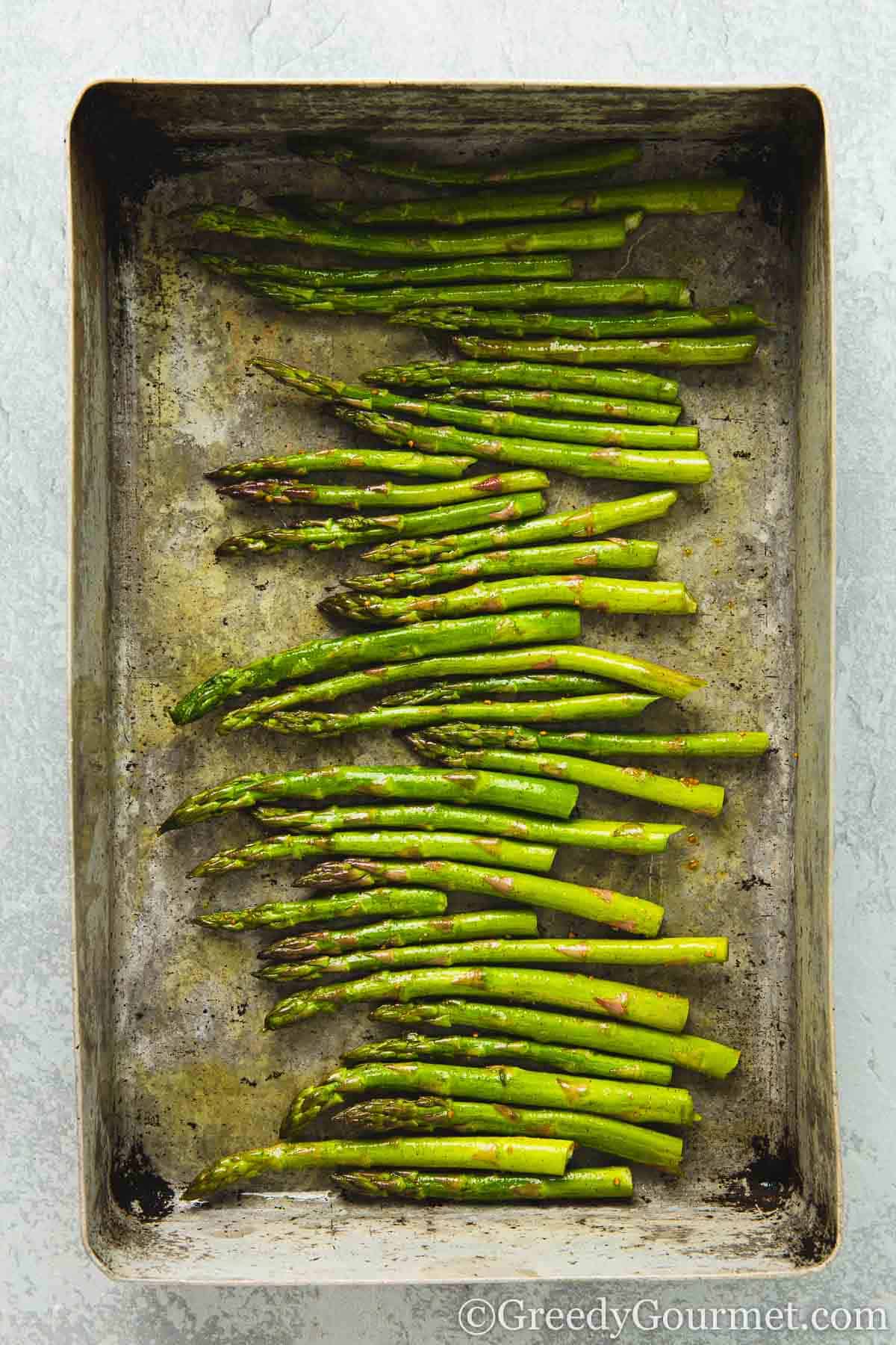 Roasted asparagus in a pan.