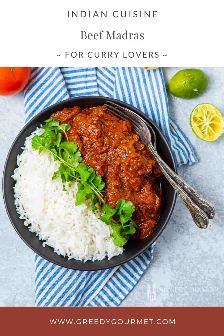 Bowl of beef madras with a side of white rice